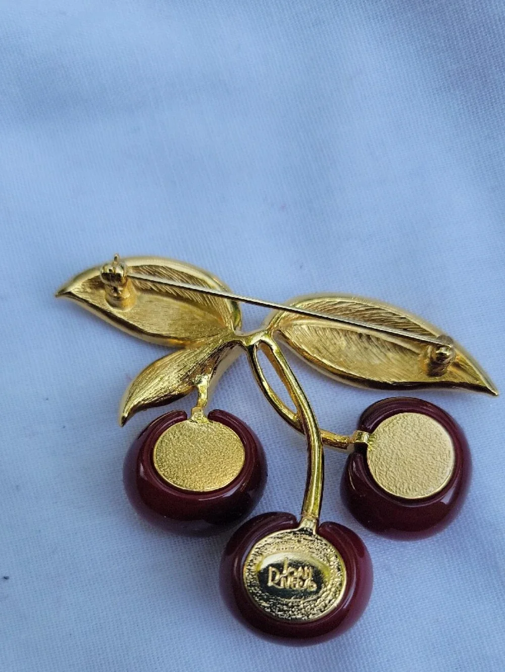 Vintage Joan Rivers Gold-Tone Red Lucite? Cherry Brooch with Crystal Leaves